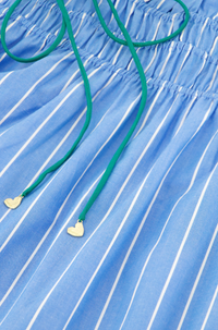 close up of green ties and ruching on the Fabienne Chapot skirt